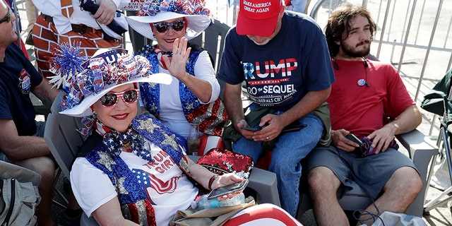 Hats and other merchandise were flying off the racks Tuesday afternoon in Orlando, ahead of Trump's rally. (AP Photo/John Raoux)