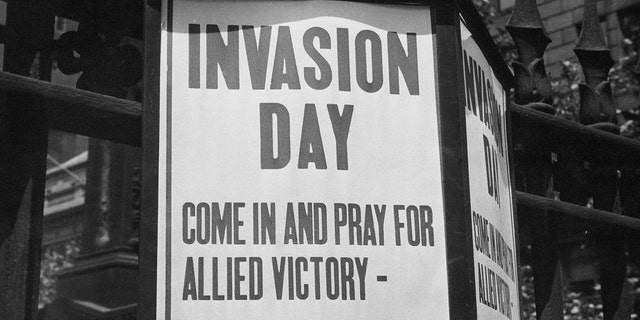 A sign outside Trinity Church in New York City is shown inviting worshippers to "come in and pray for Allied victory" during the invasion of Normandy on D-Day on June 6, 1944.