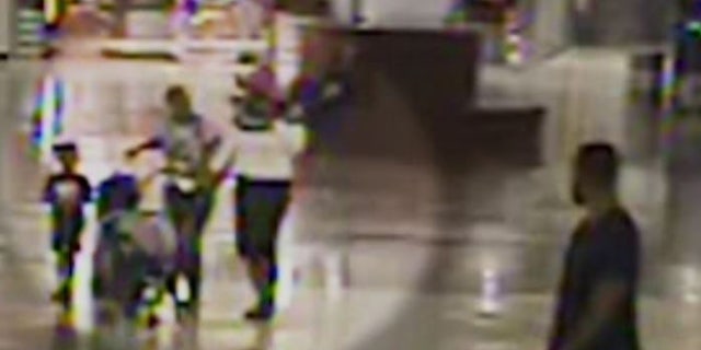 A woman, pictured, allegedly attempted to kidnap two young children who were traveling with their family through Hartsfield-Jackson Atlanta International Airport on Monday.