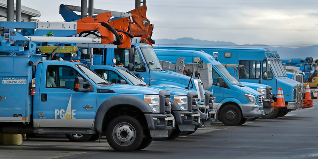 FILE - In this Jan. 14, 2019, file photo, Pacific Gas &amp; Electric vehicles are parked at the PG&amp;E Oakland Service Center in Oakland, Calif. The year's first fire danger warning in Northern California is putting Pacific Gas &amp; Electric on alert. The utility said starting Saturday, June 8, 2019, it might turn off power to thousands of customers in areas north of San Francisco and in the Sierra foothills to help reduce the risk of fire. (AP Photo/Ben Margot, File)