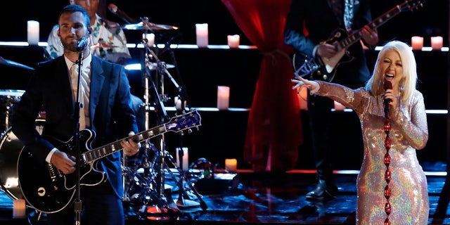 Adam Levine, Pharrell Williams and Christina Aguilera on "The Voice" in 2015.