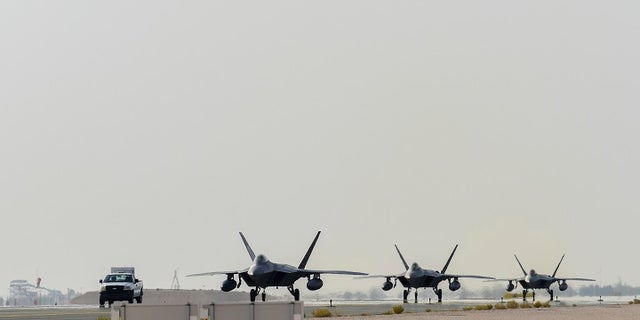 Air Force F-22 Raptors arrive at Al Udeid Air Base, Qatar, on June 27 to defend American forces and interests in U.S. Central Command.