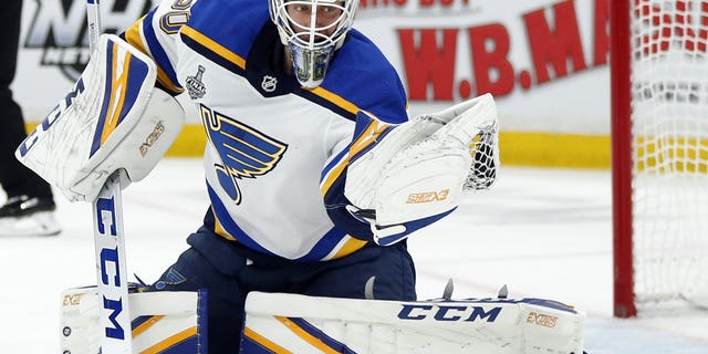 St. Louis Blues goaltender Jordan Binnington catching the puck to make a save against the Boston Bruins during the second period in Game 7 of the NHL's Stanley Cup Final on Wednesday in Boston. (AP Photo/Michael Dwyer)