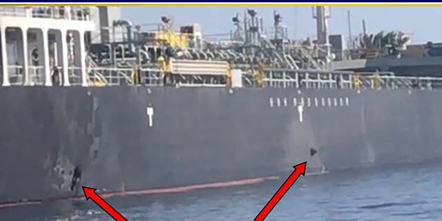 This June 13, 2019, image released by the U.S. military's Central Command, shows damage and a suspected mine on the Kokuka Courageous in the Gulf of Oman near the coast of Iran. The U.S. military on Friday, June 14, 2019, released a video it said showed Iran's Revolutionary Guard removing an unexploded limpet mine from one of the oil tankers targeted near the Strait of Hormuz, suggesting the Islamic Republic sought to remove evidence of its involvement from the scene.