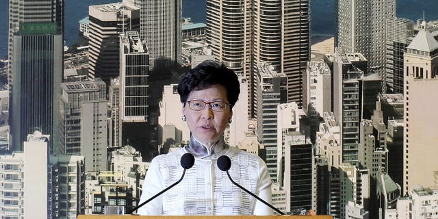 Hong Kong's Chief Executive Carrie Lam arrives holds a press conference in Hong Kong on Saturday, June 15, 2019. Lam said she will suspend a proposed extradition bill indefinitely in response to widespread public unhappiness over the measure, which would enable authorities to send some suspects to stand trial in mainland courts.