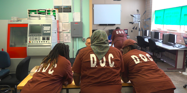 Steven Blazer, of Surge staffing, recruits inmates at a recent job fair.