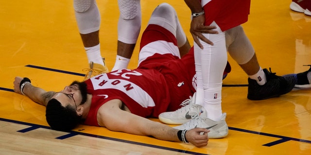 Toronto Raptors guard Fred VanVleet (23) remains on the floor during the second half of Game 4 of basketball's NBA Finals against the Golden State Warriors in Oakland, Calif., Friday, June 7, 2019. (Associated Press)