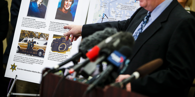 FILE - In this April 11, 2018, file photo, Snohomish County Cold Case Detective Jim Scharf, right, shares details of the unsolved case of the 1987 double homicide of Jay Cook and Tanya Van Cuylenborg, during a press conference in Everett, Wash. William Earl Talbott II charged in the slayings of the young Canadian couple is facing trial in Washington state this week. (Ian Terry/The Herald via AP, File)