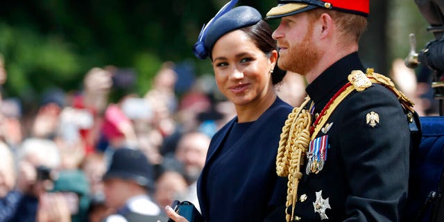 FILE: British Meghan, Duchess Sussex, and Prince Harry ride in a coach to attend the annual Trooping the Color ceremony in London, Saturday, June 8, 2019.