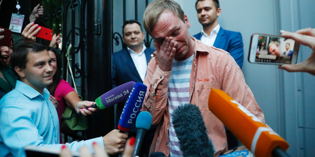 Prominent Russian investigative journalist Ivan Golunov, cries as he leaves a Investigative Committee building in Moscow, Russia, Tuesday, June 11, 2019. In a surprising turnaround, Russia's police chief on Tuesday dropped all charges against a prominent investigative reporter whose detention sparked public outrage and promised to go after the police officers who tried to frame the journalist as a drug-dealer.
