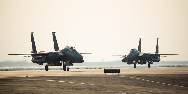 Two F-15E Strike Eagles from the 336th Fighter Squadron, 4th Fighter Wing at Seymour Johnson Air Force Base, North Carolina taxi the runway at Al Dhafra Air Base, United Arab Emirates, June 13, 2019. The F-15E’s joined ADABs inventory of other fighters to include F-15C Eagles and F-35A Lightning IIs.