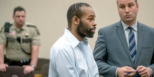 Emmanuel Aranda, who threw a 5-year-old boy over a Mall of America balcony, and his lawyer Paul Sellers, right, listen as Judge Jeannice Reding hands out a 19-year sentence at the Hennepin County Government Center, Monday, in Minneapolis. (Elizabeth Flores/Star Tribune via AP)