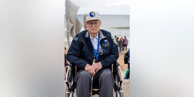 United States World War II veteran Russell Pickett, from Tennessee, poses at Omaha Beach in Saint-Laurent-sur-Mer, Normandy, France, Monday, June 3, 2019.