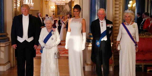 From left, US President Donald Trump, Britain's Queen Elizabeth II, first lady Melania Trump, Prince Charles and Camilla, the Duchess of Cornwall pose for the media ahead of the State Banquet at Buckingham Palace in London.