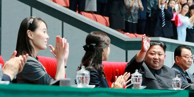 The woman next to Ri Sol Ju (center) appears to be Kim Jong Un's sister, Kim Yo Jong (left), who state media said attended the performance.