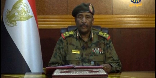 In this frame grab from video provided by Sudan TV, Lieutenant General Abdel-Fattah Burhan, head of the Sudanese Transitional Military Council, TMC, makes a broadcast announcement in Khartoum, Sudan, Tuesday, June 4, 2029. (Sudan TV via AP)