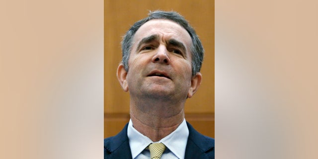 Virginia Governor Ralph Northam makes remarks at a press conference dealing with gun violence in the state, inside the Patrick Henry Building in Richmond, Va., Tuesday, June 4, 2019. (Bob Brown/Richmond Times-Dispatch via AP)