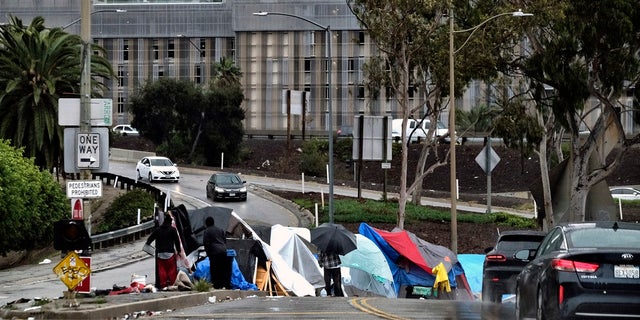 In this Jan. 14, 2019 file photo a homeless encampment is seen along a downtown Los Angeles.