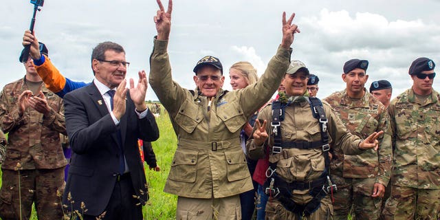 U.S. World War II D-Day veteran Tom Rice, from Coronado, CA, after parachuting in a tandem jump into a field in Carentan, Normandy, France, Wednesday, June 5, 2019. 