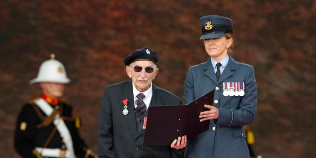 D-Day veteran John Jenkins on stage during commemorations for the 75th Anniversary of the D-Day landings, in Portsmouth, England, Wednesday June 5, 2019.