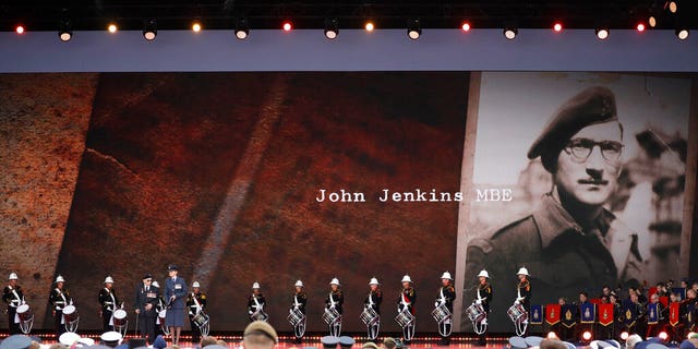 D-Day veteran John Jenkins stands onstage during an event to mark the 75th anniversary of D-Day in Portsmouth, England Wednesday, June 5, 2019.