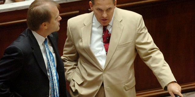 In this Aug. 30, 2005 file photo, Oklahoma State Senators Jonathan Nichols, left, (R-Norman) and Cliff Branan R-Oklahoma City, visit in Oklahoma City, Ok. shortly after a special session. Norman police are investigating after former state Sen. Jonathan Nichols was found dead of an apparent gunshot wound inside his home. (AP Photo/Bill Hefton)