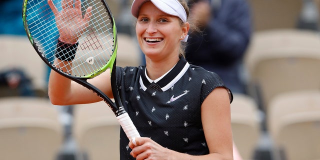 Marketa Vondrousova of the Czech Republic celebrates winning her semifinal match of the French Open tennis tournament against Britain's Johanna Konta in two sets, 7-5, 7-6 (7-2), at the Roland Garros stadium in Paris, Friday, June 7, 2019. (AP Photo/Jean-Francois Badias)