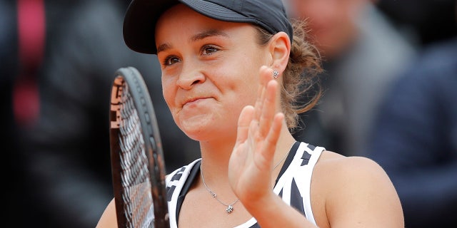 Australia's Ashleigh Barty celebrates winning her semifinal match of the French Open tennis tournament against Amanda Anisimova of the U.S. in three sets 7-6 (7-4), 6-3, 6-3, at the Roland Garros stadium in Paris, Friday, June 7, 2019. (AP Photo/Michel Euler)