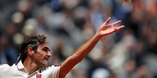 Switzerland's Roger Federer serves against Spain's Rafael Nadal during their semifinal match of the French Open tennis tournament at the Roland Garros stadium in Paris, Friday, June 7, 2019. (AP Photo/Christophe Ena)