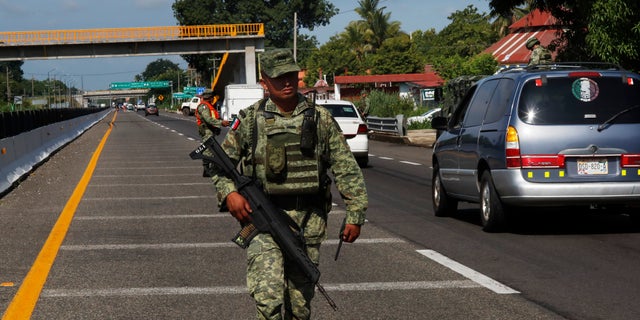 A Mexican Army soldier near an immigration checkpoint in Tapachula, Chiapas state, Mexico, this past Saturday. (AP Photo/Marco Ugarte)