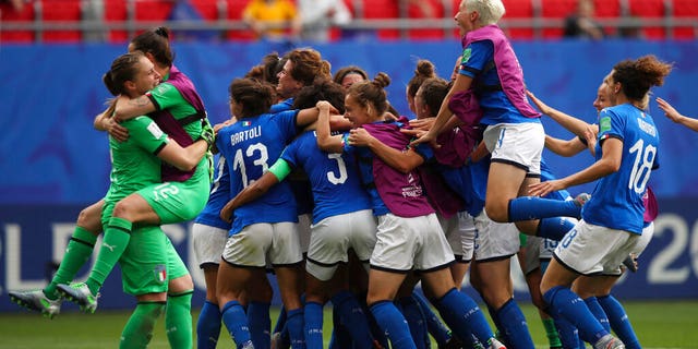 Players of Italy celebrate after winning the Women's World Cup Group C soccer match between Australia and Italy at the Stade du Hainaut in Valenciennes, Sunday, June 9, 2019.