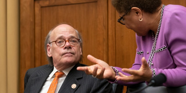 House Judiciary Committee members Rep. Steve Cohen, D-Tenn., left, listens to Rep. Karen Bass, D-Calif., as House Democrats start a hearing to examine whether President Donald Trump obstructed justice, the first of several hearings scheduled by Democrats on special counsel Robert Mueller's report, on Capitol Hill in Washington, Monday, June 10, 2019. (AP Photo/J. Scott Applewhite)