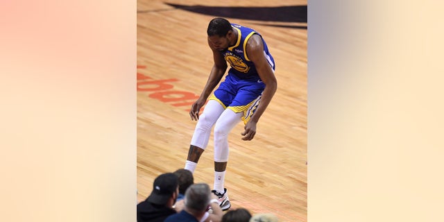 Kevin Durant (35), the Golden State Warriors forward, was injured in the right leg during the NBA's game 5 against the Toronto Raptors on Monday, June 10, 2019. (Frank Gunn / The Canadian Press via AP)