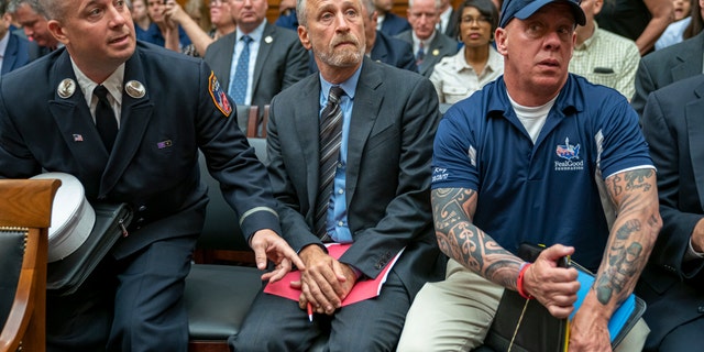 Jon Stewart lending his support to firefighters, first responders and survivors of the September 11 terror attacks at the hearing Tuesday. (AP Photo/J. Scott Applewhite)