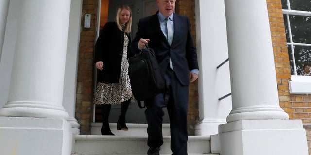 British Conservative Party lawmaker Boris Johnson leaves his home in London, Thursday, June 13, 2019. (AP Photo/Frank Augstein)