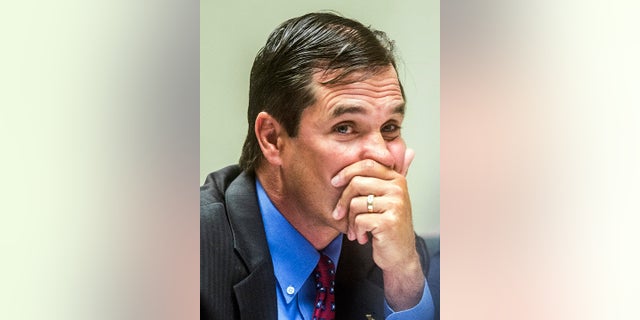 In this July 25, 2018, file photo, Nick Lyon, Michigan's Department of Health and Human Services director, looks to the judge during Lyon's preliminary examination in Genesee District Court in Flint, Mich. (Jake May/The Flint Journal via AP, File)