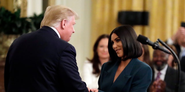 President Donald Trump shaking hands with Kim Kardashian West at the White House. The two worked together in order to pass the First Step Act which focused on criminal justice reform.