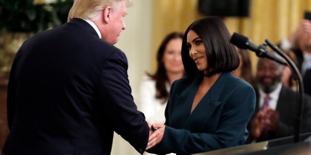 President Donald Trump shaking hands with Kim Kardashian West at the White House. The two worked together in order to pass the First Step Act which focused on criminal justice reform.
