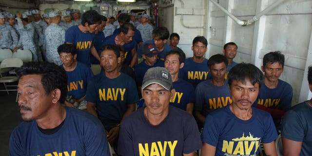 Rescued Filipino fishermen sit inside Philippine Navy ship BRP Ramon Alcuaz as they head back to shore at Occidental Mindoro province, Philippines on Friday June 14, 2019. The Philippines' top diplomat said he has filed a diplomatic protest after an anchored fishing boat was hit by a suspected Chinese vessel which then abandoned the 22 Filipino fishermen as the boat sank in the disputed South China Sea.