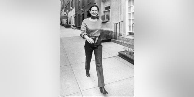 Undated file photo heiress and designer Gloria Vanderbilt walks down a New York street. (New York Post via AP, File)