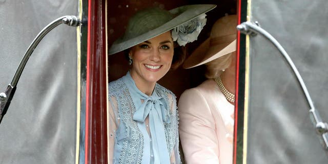 Britain's Kate, Duchess of Cambridge looks out from a carriage in Windsor Great Park on her way to Royal Ascot horse race meeting in Ascot, England, Tuesday, June 18, 2019. (Steve Parsons/PA via AP)