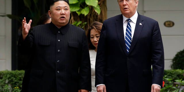 FILE: U.S. President Donald Trump and North Korean leader Kim Jong Un take a walk after their first meeting at the Sofitel Legend Metropole Hanoi hotel, in Hanoi, Vietnam.