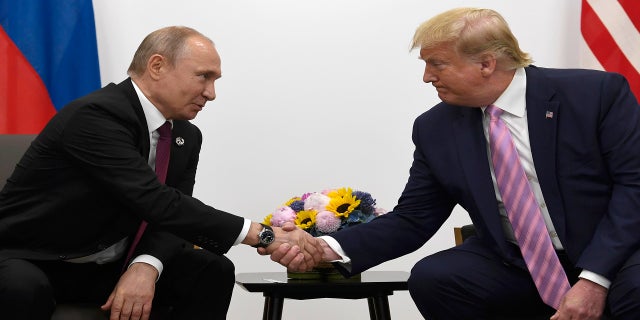 President Donald Trump, right, shakes hands with Russian President Vladimir Putin during a bilateral meeting on the sidelines of the G-20 summit in Osaka, Japan, Friday, June 28, 2019.