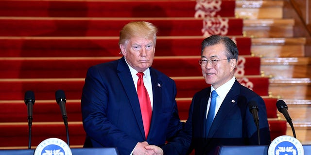 President Donald Trump, left, and South Korean President Moon Jae-in shake hands following their news conference at the Blue House in Seoul, Sunday, June 30, 2019. (Associated Press)