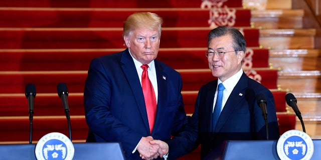 President Donald Trump, left, and South Korean President Moon Jae-in shake hands following their news conference at the Blue House in Seoul, Sunday, June 30, 2019. (Associated Press)