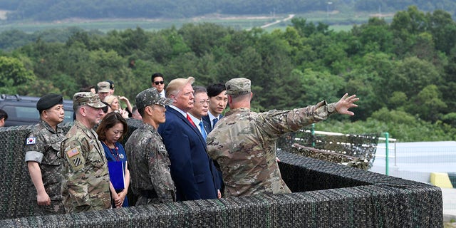 President Donald Trump views North Korea from the Korean Demilitarized Zone from Observation Post Ouellette at Camp Bonifas in South Korea, Sunday, June 30, 2019. (Associated Press)