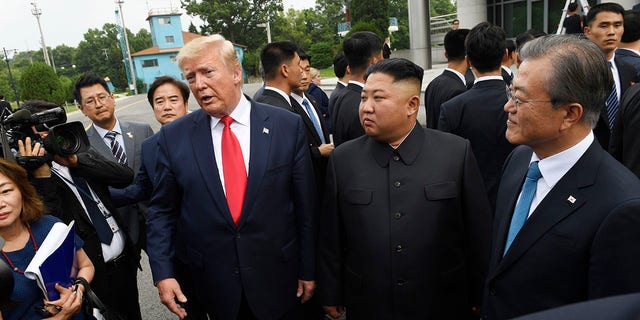 President Donald Trump meets with North Korean leader Kim Jong Un, with South Korean President Moon Jae-in, right, at the border village of Panmunjom in the Demilitarized Zone, South Korea, Sunday, June 30, 2019. (Associated Press)