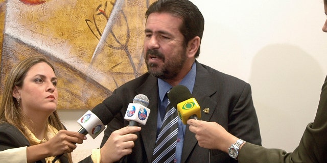 Late television show host Wallace Souza, center, seen here speaking during a news conference in Manaus, Brazil, Tuesday, Aug. 11, 2009. Brazilian police were investigating Souza on suspicion of commissioning at least five of the murders depicted in his shows to boost his ratings and prove his claim that Brazil's Amazon region is awash in violent crime. (AP Photo/A Critica, Antonio Menezes)