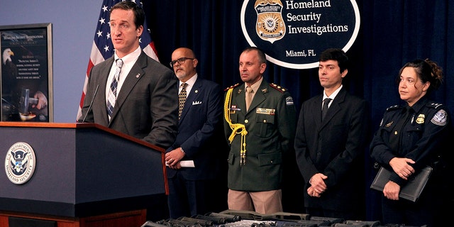 Anthony Salisbury, special agent in charge of ICE's Homeland Security Investigations (HSI) Miami, announces the results of an international weapons trafficking operation with U.S. law enforcement partners in Argentina and Brazil. (Pedro Portal/Miami Herald via AP)
