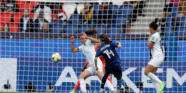 Japan's Yui Hasegawa, center, failing to score past Argentina's Florencia Bonsegundo during the Women's World Cup soccer match. (AP Photo/Alessandra Tarantino)